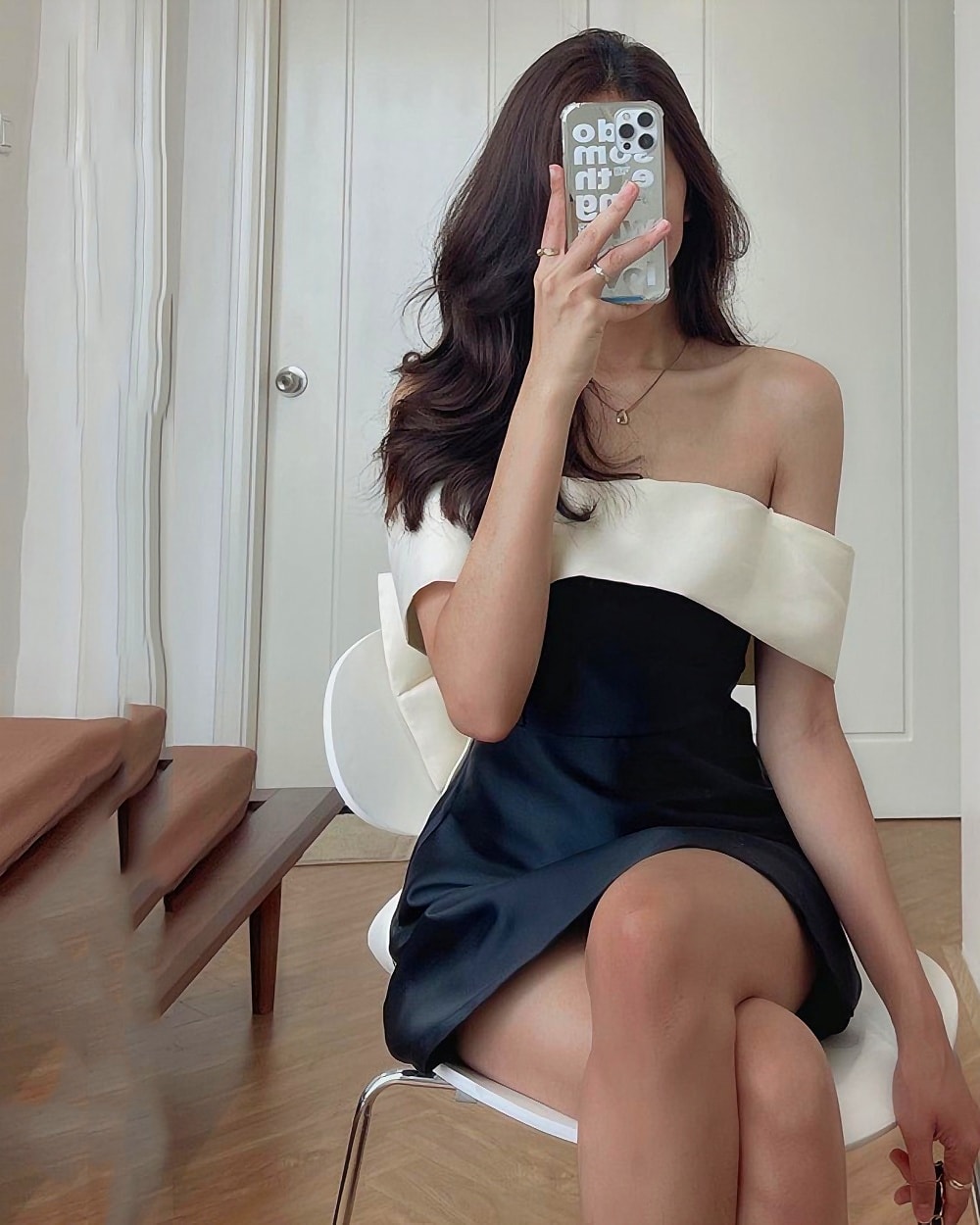 Single Bow Dress - French Aesthetic product photo 1 Single Bow Dress - French Aesthetic, a black satin mini dress with shoulder details.