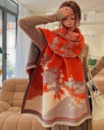 Wide vegan cashmere scarf featuring a floral print design.