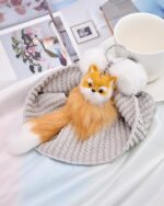 Close-up of a Korea plush little fox keychain, soft and fluffy, attached to a keyring.