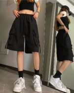 Black loose casual shorts with pockets, Korean aesthetic style.