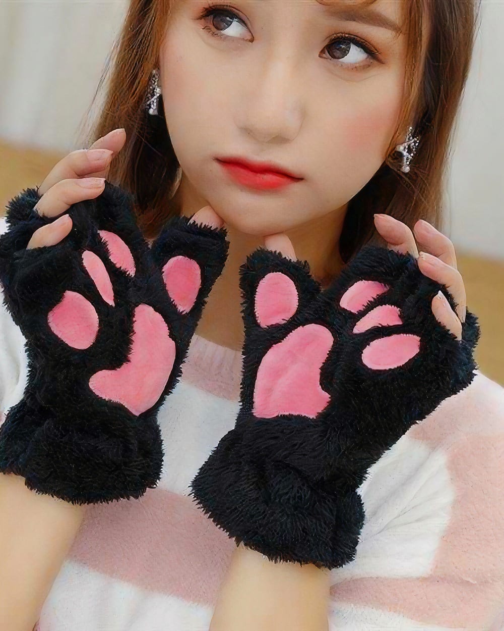 Pair of black neko paw gloves from the Winter Collection, featuring plush paw details.