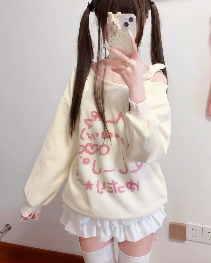 A beige Nyanko Pastel sweatshirt featuring a cute kawaii design.