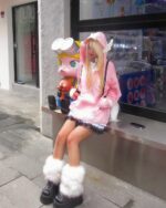 Person wearing a Loose Thick Feathered Hoodie - Harajuku Aesthetic with pink accessories and boots.