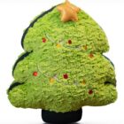 Small, green Christmas chonky plushie with lights and a star.