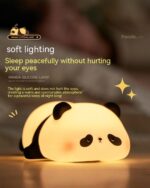 Panda silicone lamp emitting soft light, cute panda decor for night.