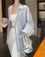 Long-sleeved striped casual shirt in Korean aesthetic style, light blue and white stripes.