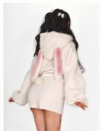 Cream-colored bunny hooded plush pajamas featuring floppy ears and a soft, plush material.