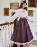 Cottagecore aesthetic dress featuring a white blouse and a deep purple, layered skirt with lace trim.