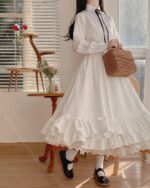 White gothic lolita ruffled skirt with lace trim, high waist design.