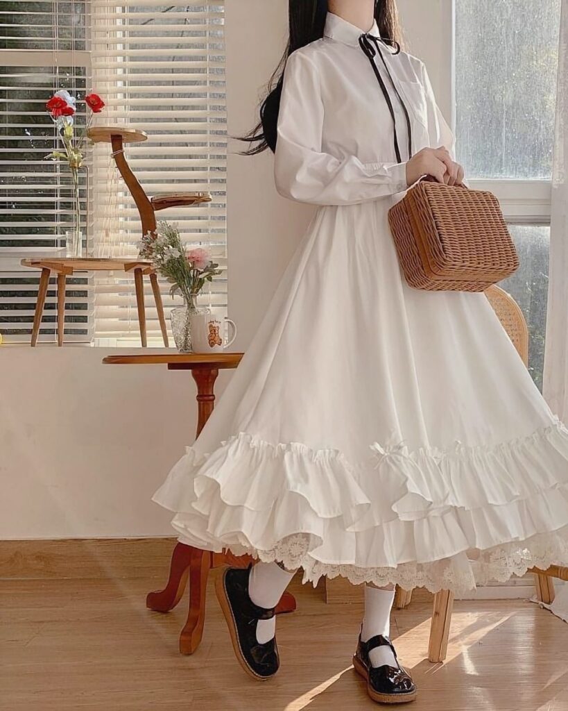 White gothic lolita ruffled skirt with lace trim, high waist design.