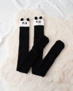 Black and white kawaii fluffy socks featuring panda designs. Winter long socks.