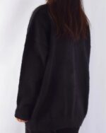 Black kawaii neko sweater, goth punk aesthetic, shown on a person's back.