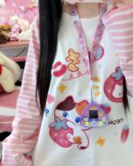 Close-up of a kawaii striped shirt featuring animal and character motifs.