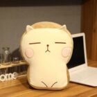 A beige catoast plushie, shaped like a slice of toast with cute facial features.