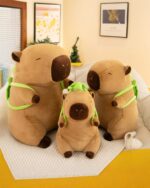 Backpack Cabypara - Turtle Collection plush capybara backpack with two smaller versions.