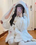 White fluffy rabbit ears hoodie worn by a person. Kawaii rabbit ears hoodie.