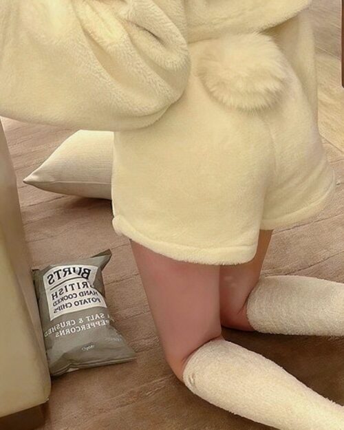 Close-up view of kawaii hooded pajamas featuring a plush, cream-colored design.