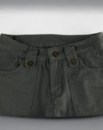Close-up of gray y2k aesthetic pants featuring a high waist and button closure.