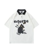 Short-sleeved cat graphic tee featuring a black cat illustration and text on a polo shirt.