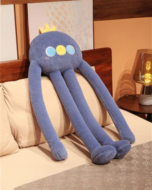 Blue long-legged bear plushie sitting on a bed, kawaii style.
