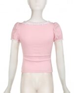 Pink coquette aesthetic top with lace trim around the collar and sleeves.