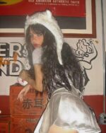 Silver pleated skirt worn by a model, coquette aesthetic style.