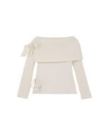 Off-shoulder long-sleeved kawaii aesthetic sweater, cream ribbed knit with bow detail.