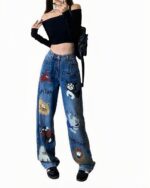 Blue graffiti y2k jeans with cartoon animal illustrations, wide-leg style.