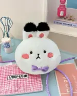 White plushie with black eyes and ears, a love and deepspace plushie fan-made design.