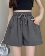 Gray elastic casual shorts with pockets, Korean aesthetic style.