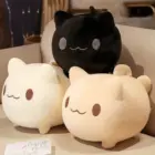 Two round neko plushies, one black and one beige, displayed on a table.