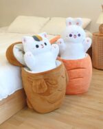 Kawaii taiyaki plushie containing plush cat and bunny toys inside a brown fabric shell.