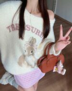 Cream-colored bunny aesthetic sweater with vintage-style artwork, featuring two rabbits.