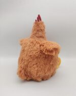 Soft, plush back view of a Fat Chicken plushie. It's a tan color with a red comb.