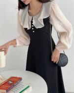 Black Puff Sleeve Dress - French Aesthetic showcasing a fitted bodice and sheer sleeves.