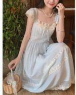 Light blue cottagecore aesthetic dress with lace details and a gathered skirt.