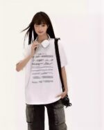Model wearing an artsy aesthetic tee featuring musical notes.