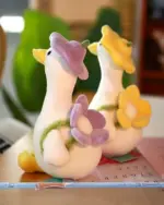 Kawaii Molly the Little Flower Duck plushie toy. Soft, pink duck with flower details.