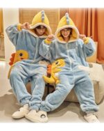Couple wearing blue dino-shark jumpsuit with hood and paw details, including slippers.