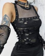 Close-up of a black gothic mesh top, featuring cutouts and lacing details. This gothic mesh top is a unique fashion piece.