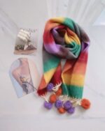 Fluffy kawaii rainbow scarf with colorful stripes and pom-poms.