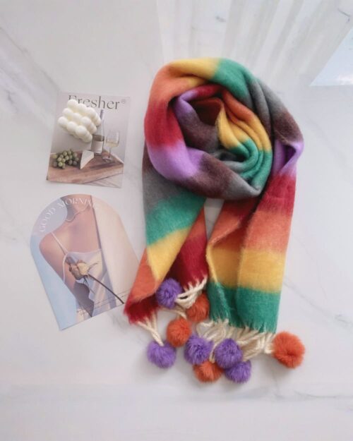 Fluffy kawaii rainbow scarf with colorful stripes and pom-poms.