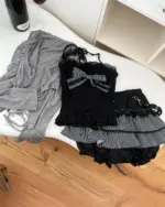 Dark gyaru set consisting of a black corset top and layered skirt, gothic lolita style.