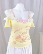 Yellow yume kawaii crop top with pink bows and 'Sweet baby' print.