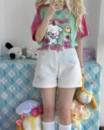 Model wearing Kawaii Sweet Wishes Tee - Lolita Aesthetic with cute pastel accessories and plush toys.