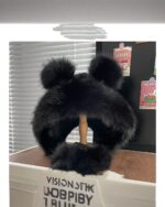 Thick fluffy bear ears hat, black winter accessory with large pom-poms.