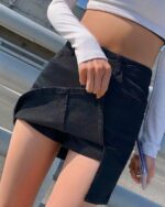 Black y2k aesthetic skirt with high waist and front slit detail.