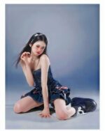 Laced Denim Mini Skirt - Y2K aesthetic skirt showcasing a distressed, layered denim design.