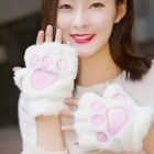 White neko paw gloves worn by a woman, part of the Winter Collection.