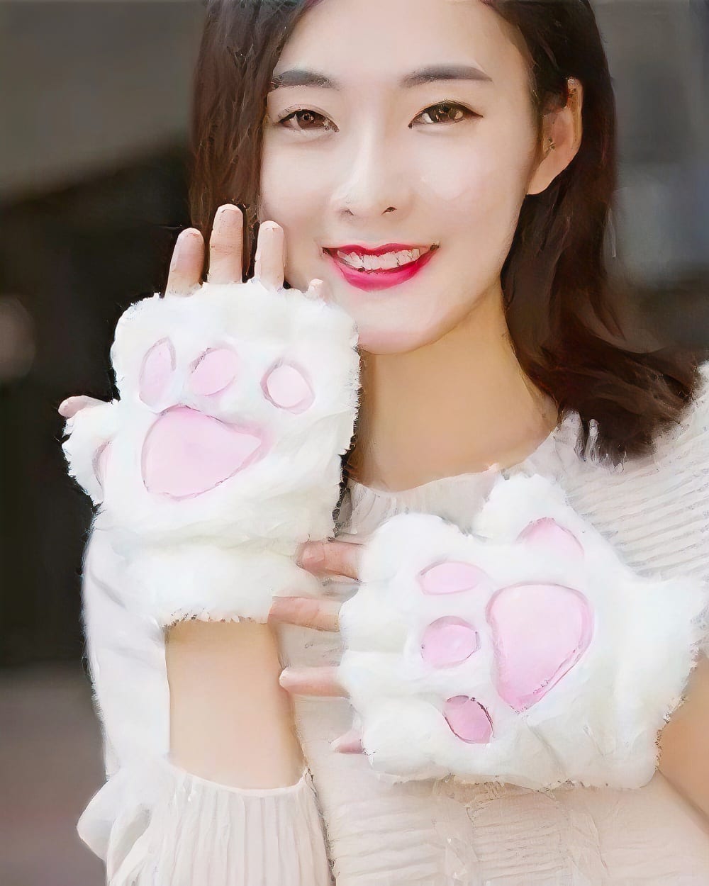 White neko paw gloves worn by a woman, part of the Winter Collection.